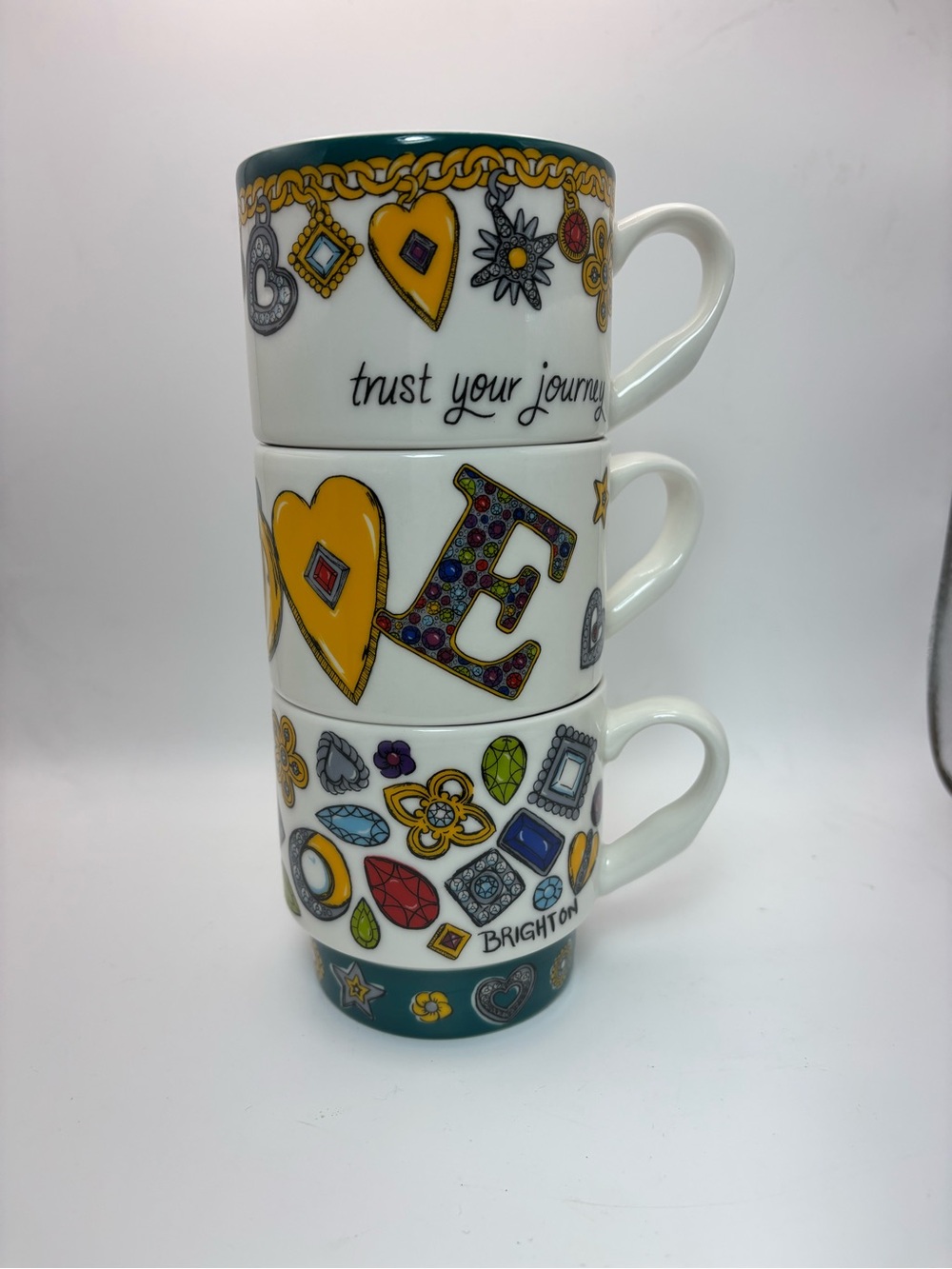 Brighton Stackable Ceramic Mugs with Western Charm Accents and Text.